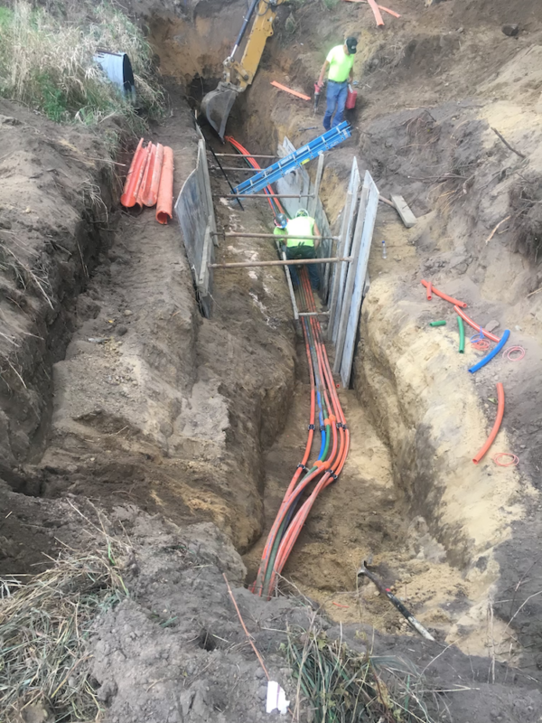 Treton Trench pulling fiber optic cable underground